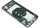 Tapa trasera Space Gray usada para iPhone XS (A1920, A2097) con puerto de carga y componentes preinstalados.
