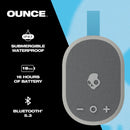 Altavoz inalámbrico portátil Skullcandy Ounce XT gris claro, diseño compacto y moderno.
