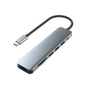 Adaptador hub multipuerto USB-C 7 en 1 HC-13Q plateado. Conexiones HDMI 4K, USB 3.0, PD, dos USB 2.0 y lectores SD/TF.