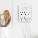 Cargador multipuerto Brookstone blanco con 6 puertos, incluyendo USB-C y USB-A, para carga rápida de dispositivos SlowBack.