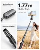 Trípode selfie stick negro con rotación 360° y botón auto pop-up, ideal para fotografía y videollamadas con celular.