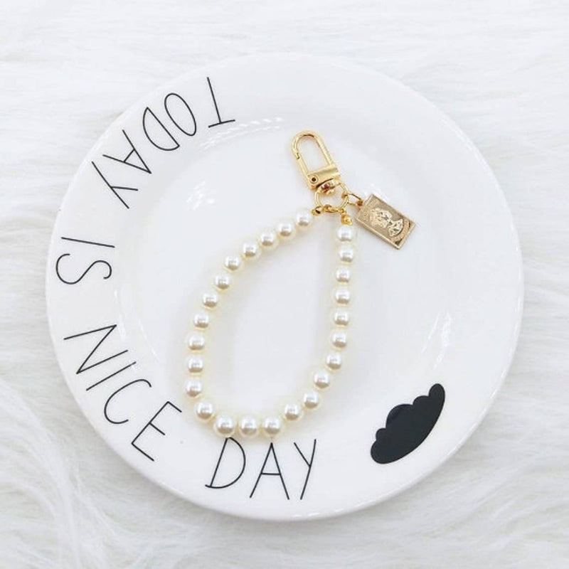 Encuentra la mejor funda rígida para AirPods 1/2 con correa de mano en Guatemala en SlowBack.